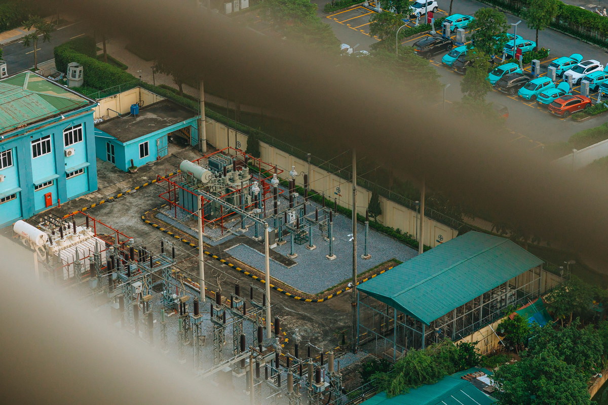 High-voltage electrical grid and substation infrastructure viewed from above